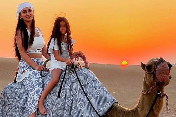 Dubai Desert Safari: Dune Drive Camel & 5<em> BBQ Shows Stargazing – Key points to know before booking’ /></p>
<ul>
<li><strong>Red-dune driving in Lahbab:</strong> The included 4WD session lasts about 15 minutes and is the tour’s main burst of adventure.</li>
<li><strong>Sunset photo stop:</strong> You have time to take pictures with family or friends before heading to the camp.</li>
<li><strong>Camel ride and sandboarding:</strong> Both are included, but the camel activity is a short traditional ride. Longer rides cost extra.</li>
<li><strong>BBQ buffet for $49:</strong> Dinner includes vegetarian and nonvegetarian choices, plus unlimited water, tea, coffee, and soft drinks.</li>
<li><strong>Three evening shows:</strong> Belly dancing, Tanoura dancing, and a fire performance follow the meal and camp activities.</li>
<li><strong>Optional paid upgrades:</strong> Quad bikes, dune buggies, horse riding, falcon activities, VIP seating, and private transport are not part of the base fare.</li>
</ul>
<h2>From Dubai hotel to Lahbab’s red dunes</h2>
<p><img width="669" height="446" decoding="async" src=
