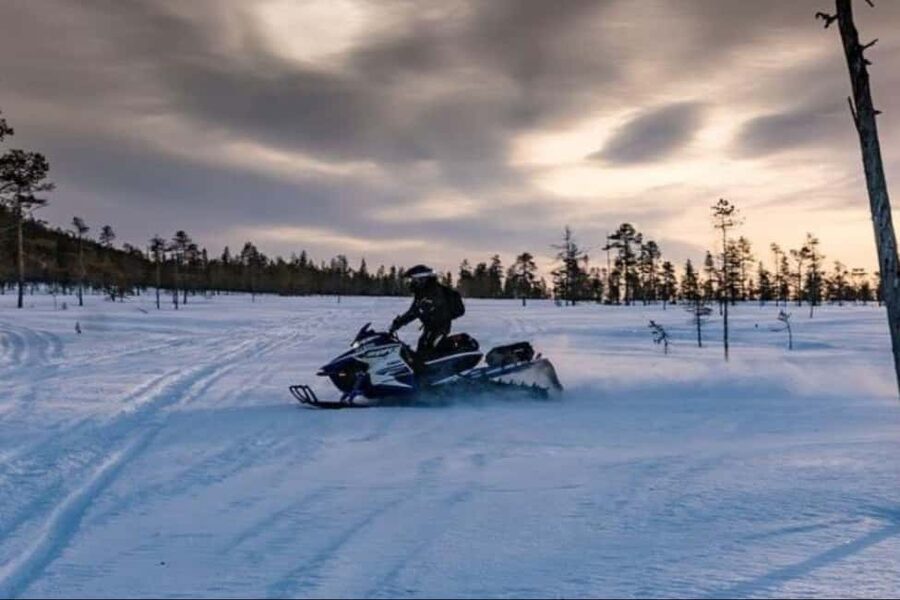Levi: Twilight Snowmobile Safari & Stargazing Experience - Getting suited up for an Arctic ride