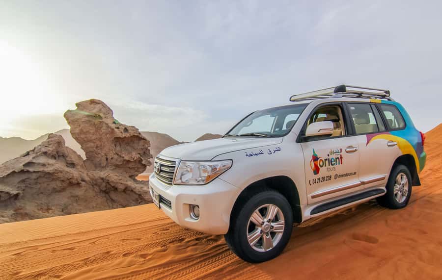 Mleiha Desert Safari with Sandboarding, Stargazing & Dinner - Dune bashing across the Mleiha dunes